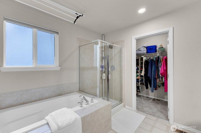 another view of primary bath with walk-in closet | Image 16