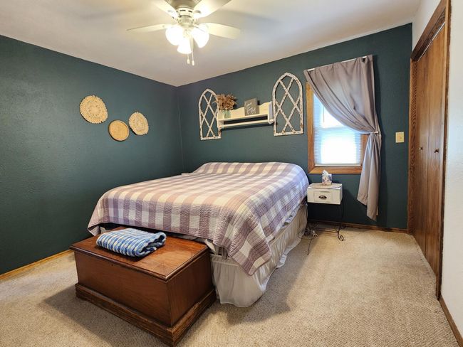 Primary bedroom on main floor overlooks serene back yard. | Image 10