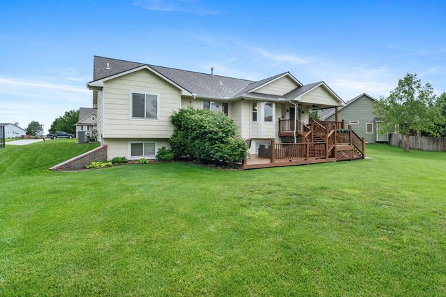 Rear view of house with roof with shingles and a porch | Image 27
