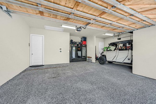 Garage with a garage door opener | Image 32