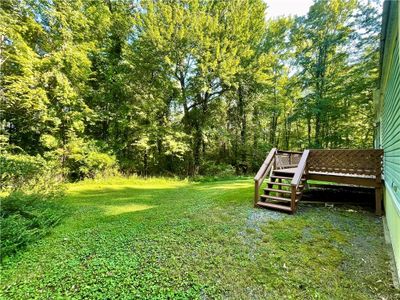 View of yard with a deck | Image 2