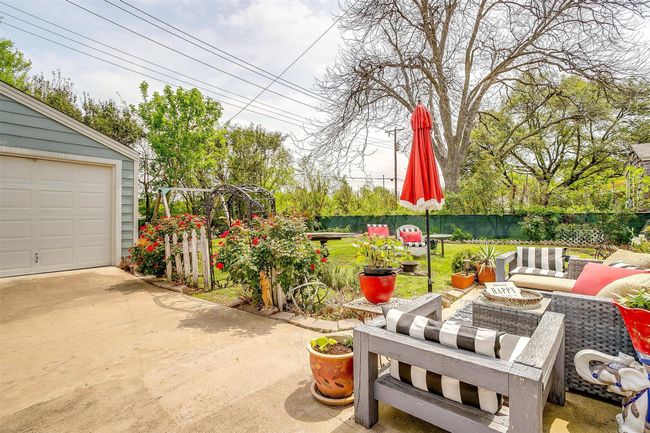 View of patio / terrace with an outdoor hangout area and fence | Image 7