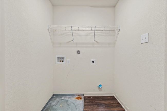 Washroom with laundry area, baseboards, hookup for a washing machine, dark wood-style floors, and hookup for an electric dryer | Image 18