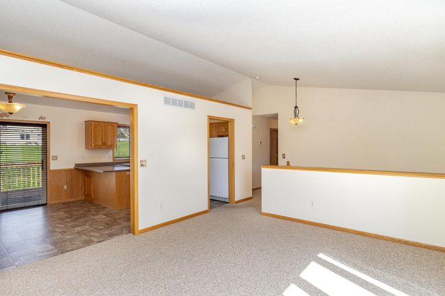 View from living room to kitchen/dining area. | Image 7