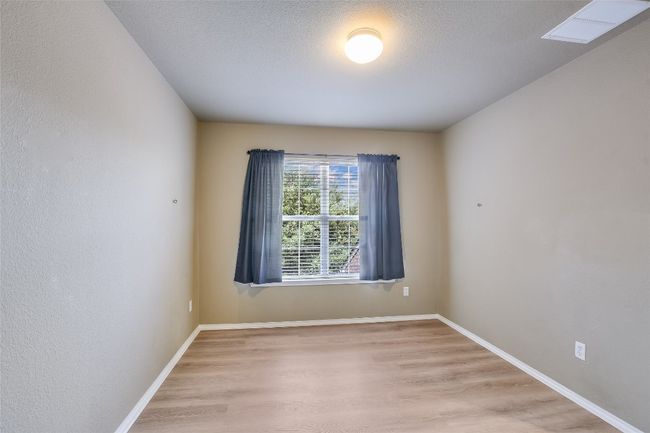 Spare room featuring light wood-type flooring and baseboards | Image 15
