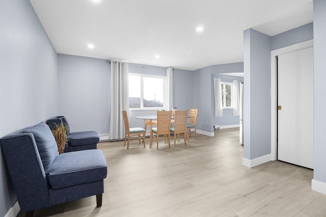 Dining room featuring a healthy amount of sunlight, baseboards, light wood-style floors, and recessed lighting | Image 23