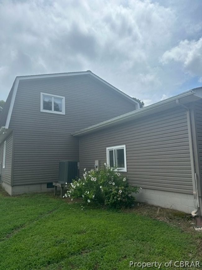 Rear view of property with a lawn | Image 24