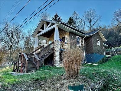 View of side of home with a yard | Image 2