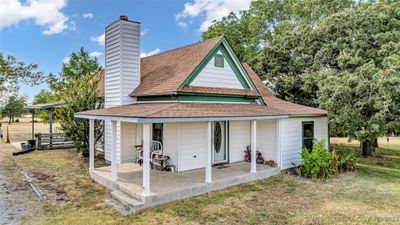 Home featuring large covered porch | Image 1