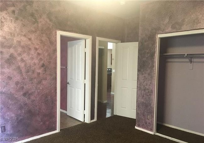 Bedroom with carpet floors and a closet | Image 14
