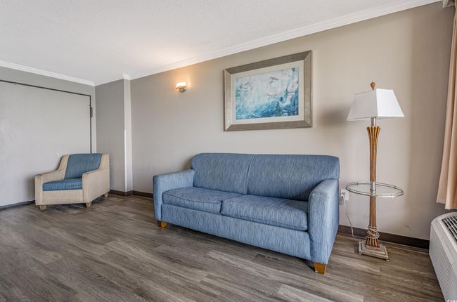 Living room featuring wood finished floors and ornamental molding | Image 11