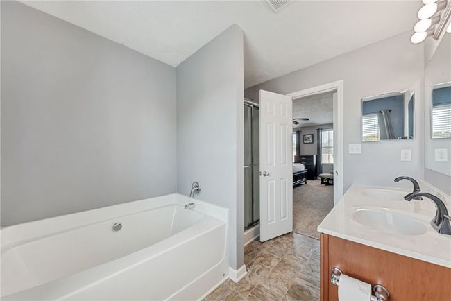 Soak in the tub or refresh yourself in the shower. | Image 25