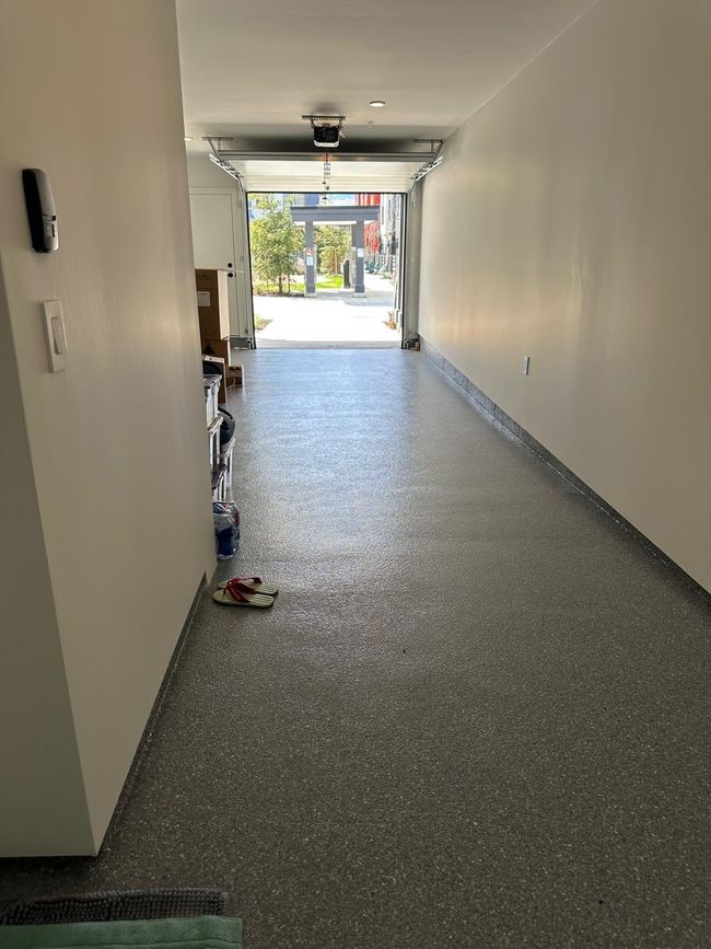 Garage with baseboards and a garage door opener | Image 13