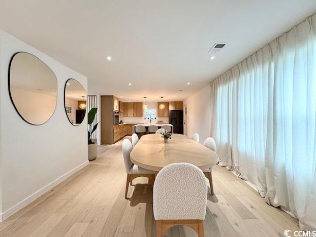 Dining space featuring light wood-type flooring and recessed lighting | Image 7