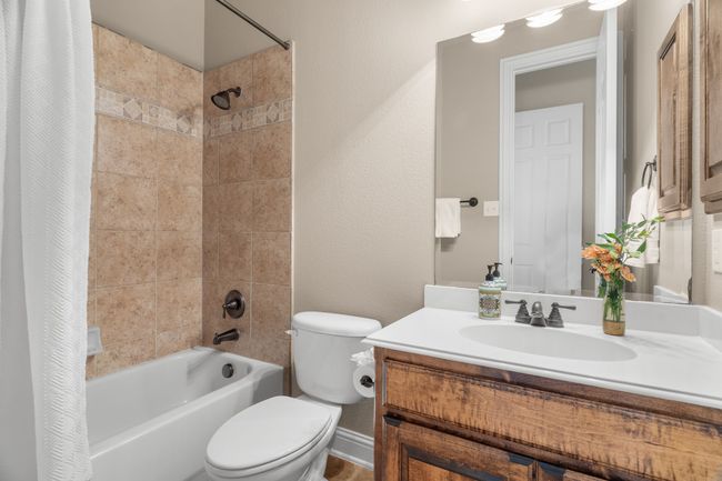 Full bath adjacent downstairs bedroom off playroom/den | Image 23
