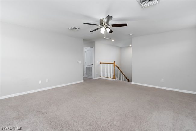 Carpeted spare room with ceiling fan | Image 17