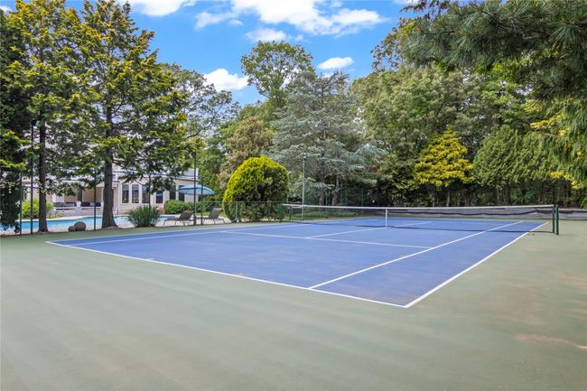 View of tennis court featuring community basketball court | Image 29