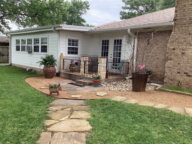 Back of property with roof with shingles, cooling unit, and french doors | Image 8