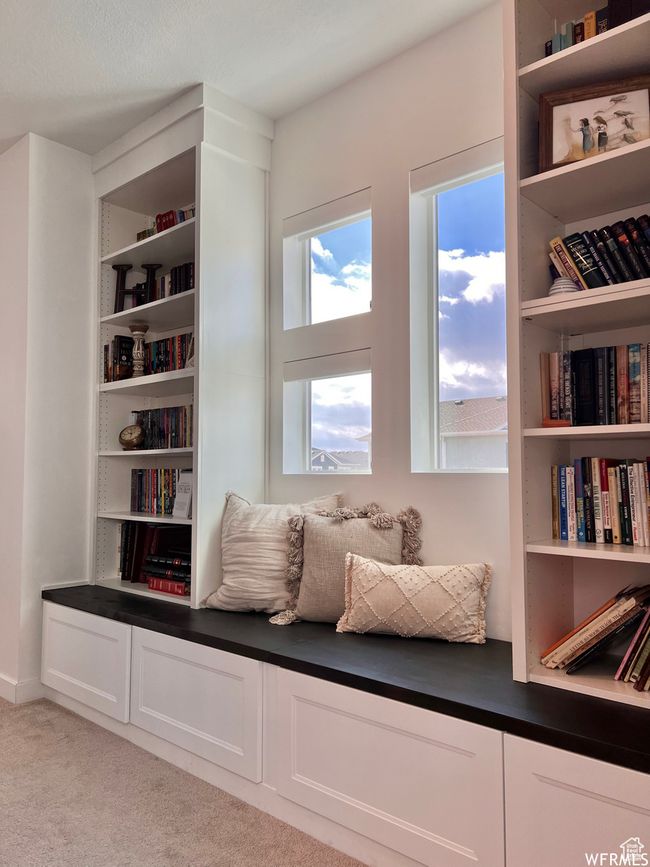 Living area featuring light colored carpet | Image 11