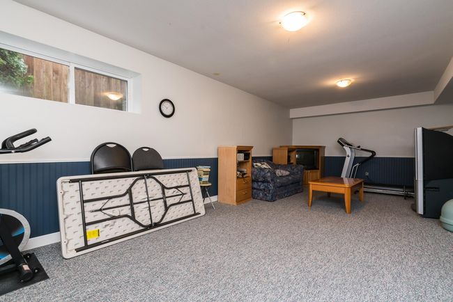 Interior space featuring wainscoting and carpet | Image 20