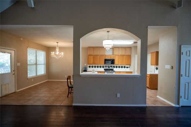 view of kitchen & breakfast nook from second living area | Image 10