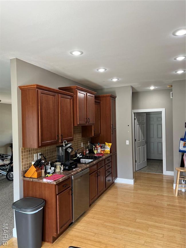 Kitchen with dishwashing machine, backsplash, recessed lighting, and light wood finished floors | Image 6