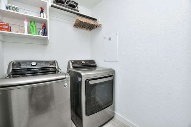 Laundry area with baseboards, independent washer and dryer, and laundry area | Image 21