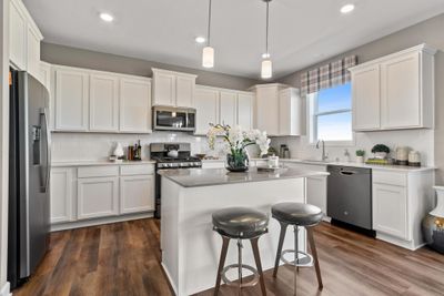 (Photo of decorated model, actual home's finishes will vary) All of the stainless appliances are included! | Image 1