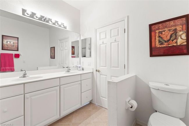 Master Bathroom featuring dual vanity, toilet, and tile floors | Image 24