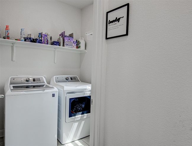 Laundry area with Shelves. Roller Shade Installed – First Floor | Image 17