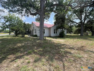 Side view of house and corner lot | Image 1