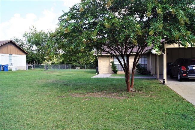 View of yard featuring a carport | Image 15