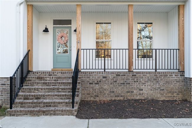 Entrance to property with a porch | Image 49