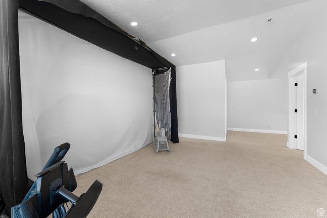 Carpeted loft area with recessed lighting | Image 25