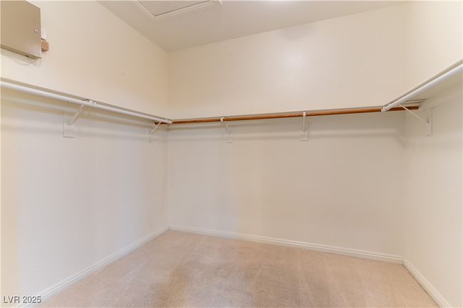 Spacious closet featuring light carpet | Image 27