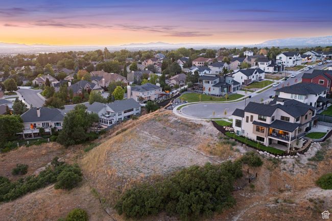 Aerial view of residential area featuring a mountainous background | Image 20