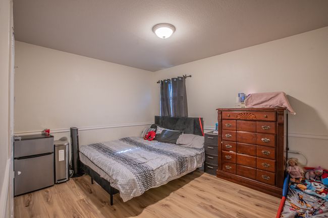Bedroom featuring wood finished floors | Image 26