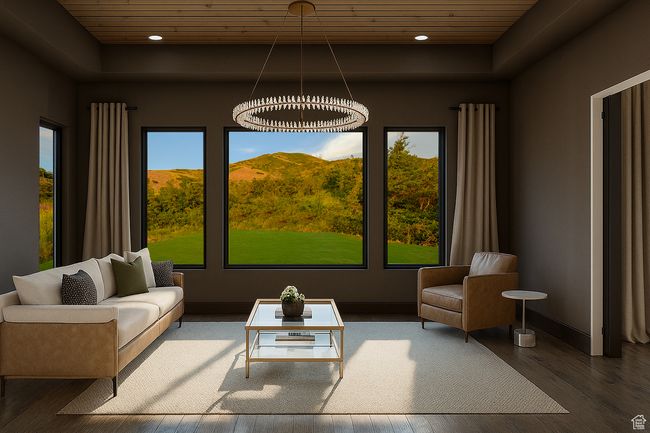 Living area with a tray ceiling, wooden ceiling, wood finished floors, and recessed lighting | Image 8