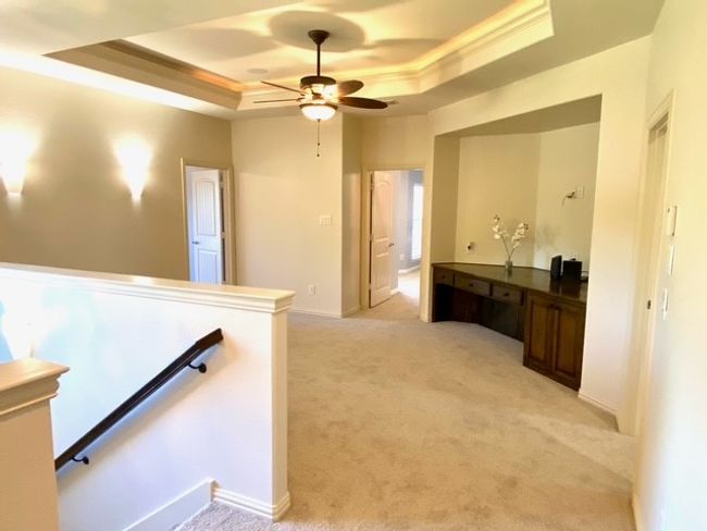 Upstairs landing, light carpet, a tray ceiling & work desk | Image 27