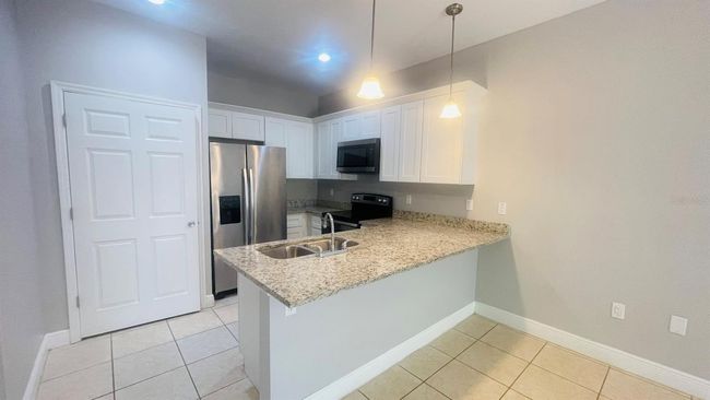 1589 Cumin Dr, Home with 2 bedrooms, 2 bathrooms and null parking in POINCIANA FL | Image 11