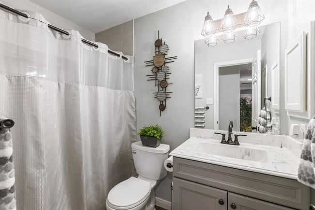 This full bathroom serves as a guest bathroom and bathroom for the second bedroom. | Image 38