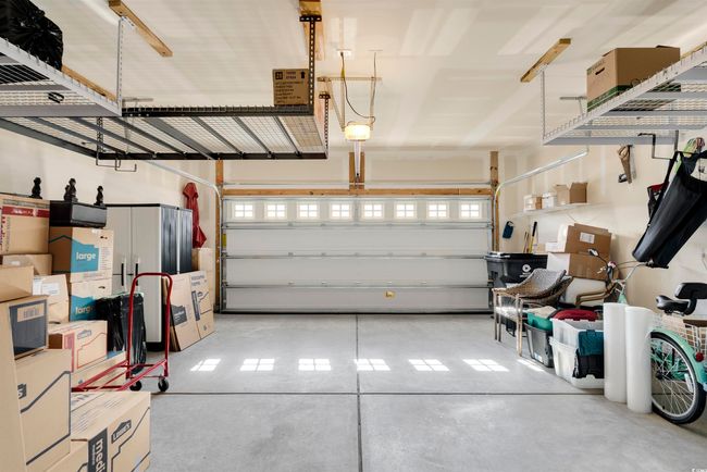 Garage featuring a garage door opener | Image 40