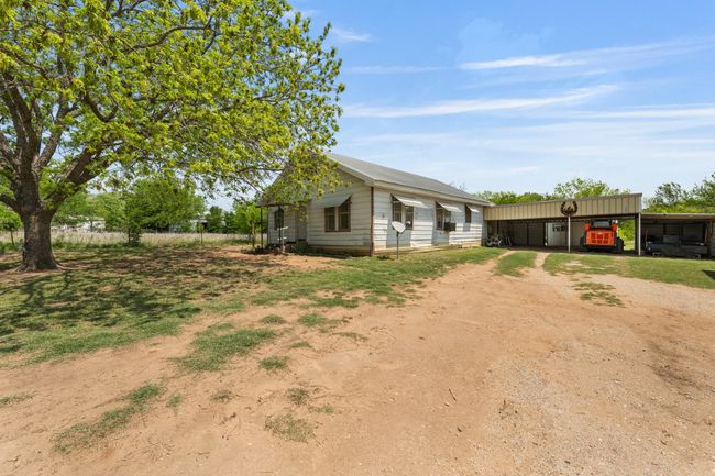 View of front of home featuring driveway and an outbuilding | Image 28