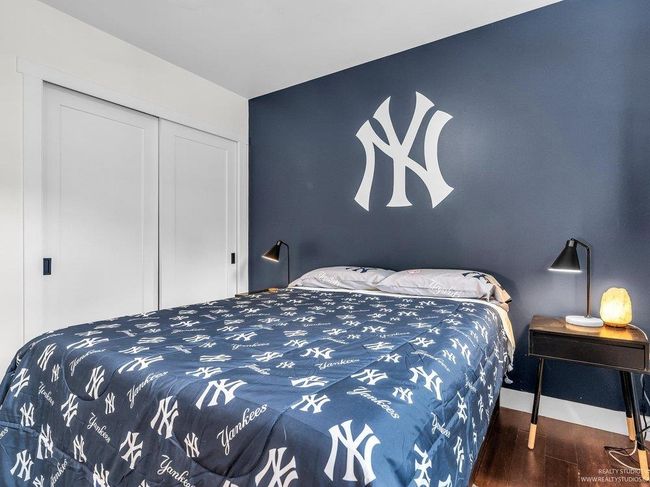 Spacious 3rd Bedroom on the upper floor with with new ceiling fan/light, new window, baseboards and closet system with new doors and new bedroom door. | Image 31