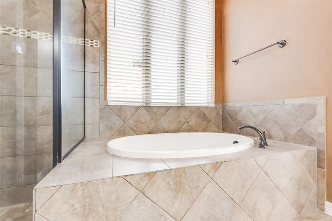 Full bath with tiled shower and a bath | Image 25