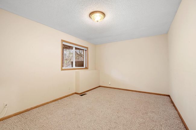 One of three very sizeable bedrooms in lower level | Image 53