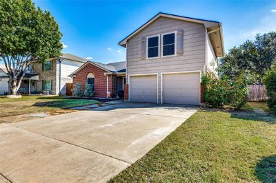 Front of property with a garage and a front lawn | Image 2