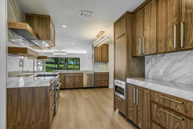 Kitchen featuring abundance of storage and countertop space | Image 11