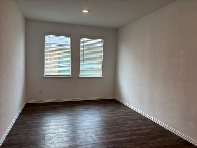 Empty room featuring dark wood finished floors and baseboards | Image 9