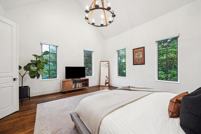 BEDROOM TWO. Note the stunning vaulted ceiling and multiple windows. | Image 23